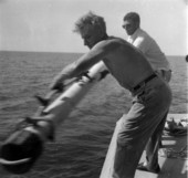 Fred Logan and Art McKee move the equipment over the wreck of Capitana- Plantation Key, Florida .