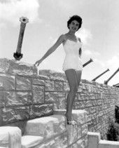 Jackie Sweeting poses on the wall of the McKee's Museum of Sunken Treasure - Plantation Key, Florida