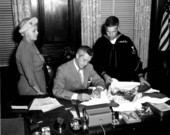 Governor LeRoy Collins signing Florida flag to be carried to the South Pole - Tallahassee, Florida.