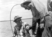 Everett Williams gets a laugh from Carl Hansen for a catfish catch - Ten Thousand Islands, Florida