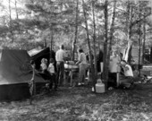 Families cooking beside their deer hunting camps - Umatilla, Florida.