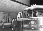 Exiting a Davis-Wylly's Night Club tour bus at night - Miami, Florida