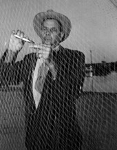 H. O. Marshall mending his fishing net - Apalachicola, Florida.