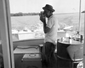 Photographer takes pictures from a fishing boat off the Marquesas Keys