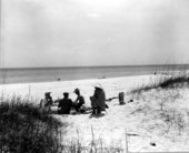 People relax on the beach.