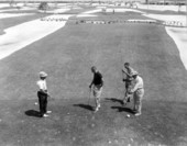 Golfers play on a three par golf course - Key Colony Beach, Florida