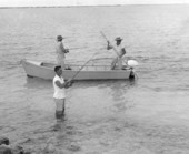 Two fishermen fishing near the shore during the World Series of Sport Fishing - Marathon, Florida