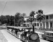 Conch tour train passing through a residential area - Key West, Florida.