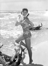 Kathy Magda models a bathing suit on the beach at Saint Andrews State Park.