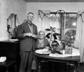 Major Richard E. Bergren and his wife having tea made from the tung tree in Gulf Breeze, Florida.