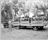 Tour guide shows tourists on the tram a plant - Sebring, Florida .