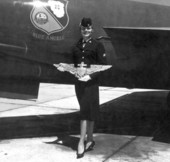 Joan Simmons poses next to a Blue Angels airplane during the anniversary of a Naval air station - Pensacola, Florida.