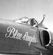 Joan Simmons poses from the cockpit of a Blue Angels airplane during the anniversary of a naval air station - Pensacola, Florida.