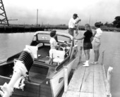 Family preparing to board boat for excursion from Apalachicola to Pensacola.