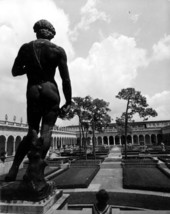 Bronze cast of David looking over the garden courtyard of the Ringling Art Museum - Sarasota, Florida.
