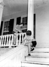 Two women scraping off paint at DeBary Hall, home of Florida Federation of Art - De Bary, Florida