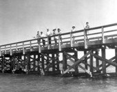 Men and women fishing on the pier during Florida Keys boat trip - No Name Key, Florida