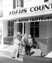 People with brooms at Adam's Country Store - White Springs, Florida