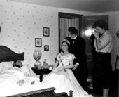 A woman taking picture of President Lincoln in his deathbed at the London Wax Museum - Saint Petersburg Beach, Florida