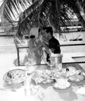 A couple chatting after ordering stone crabs and other dishes - Florida Keys, Florida