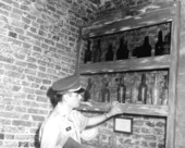 Sergeant Lewis Colee with collection of old bottles - Saint Augustine, Florida