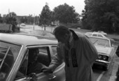 Governor Kirk wearing a Florida Highway Patrol raincoat on campus of the University of Florida - Gainesville, Florida.