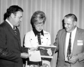 Governor Claude Kirk presenting award to Ross Allen while Mrs. Allen looks on - Tallahassee, Florida.
