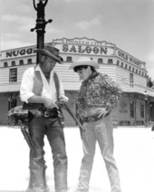 Cowboy reenactor with young visitor at Pioneer City - Davie, Florida.