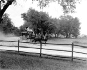 Visitors on stagecoach at Pioneer City - Davie, Florida.