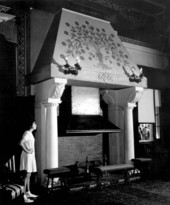 A young girl looking at the cairn fireplace at the Flagler Museum - Palm Beach, Florida.