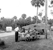 Family picnicking at Collier-Seminole State Park camp grounds - Collier County, Florida.