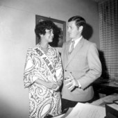 Jean Hartnett, Miss Airlines International, standing with a man
