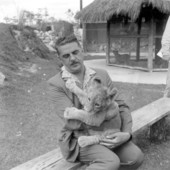 Man holding lion cub at the Lion Country Safari zoo.