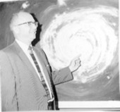 Vaughn Carmichael in front of an image of a hurricane - Miami, Florida.