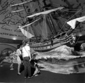 A couple looking at a Spanish galleon model displayed at McKee's Museum of Sunken Treasure - Plantation Key, Florida
