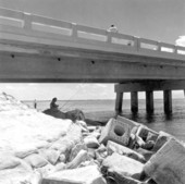 Fishing under a Card Sound bridge