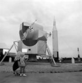 Mother and child looking at a lunar module - Cape Canaveral, Florida.