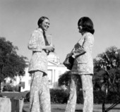 Unidentified women model the new uniforms for the welcome station attendents