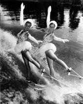 Two women on water skis wearing tutus and white gloves- Cypress Gardens, Florida