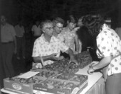 Woman buying strawberries at Plant City's Strawberry festival.