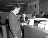 Governor Kirk examining IBM computer equipment