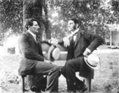Two gentlemen sitting on a bench