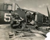 Mr. R.W. Thompson, representative of Gruman Aircraft Engineering Corp. catching Florida lobster in a crashed F6F aircraft..
