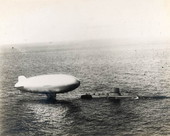 Blimp from Naval Air Station Key West refueling from submarine near Key West..