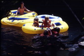 View showing visitors with inflatable toy rafts at Ichetucknee Springs State Park - Fort White, Florida.