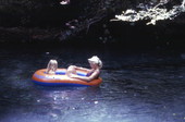 Visitors in inflatable toy raft at Ichetucknee Springs State Park - Fort White, Florida.