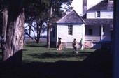 Park visitors in front of the main house at Kingsley Plantation State Historic Site - Fort George Island, Florida.