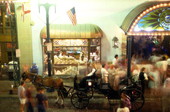 View showing a horse-drawn carriage in front of Rosie O'Grady's at Church Street Station in Orlando, Florida.