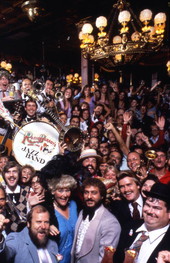 Crowd gathered with the Rosie O'Grady's Good Time Jazz Band for a group portrait at Church Street Station in Orlando, Florida.