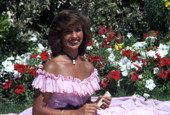 Unidentified Southern Belle in a pink vintage dress at the Cypress Gardens theme park in Winter Haven, Florida.